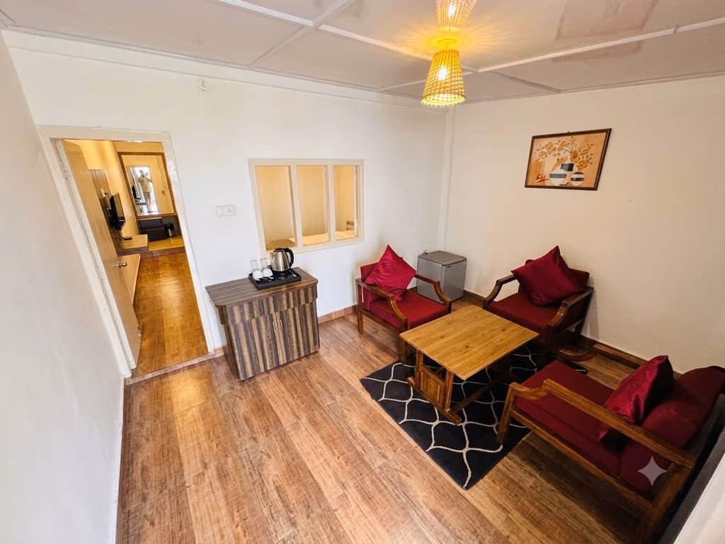 The seating area of Luxury King room 103 looking towards the entrance