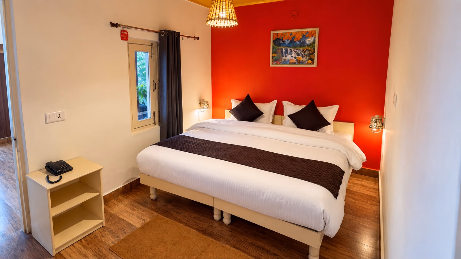 Bedroom in Luxury King room 104 with a red feature wall