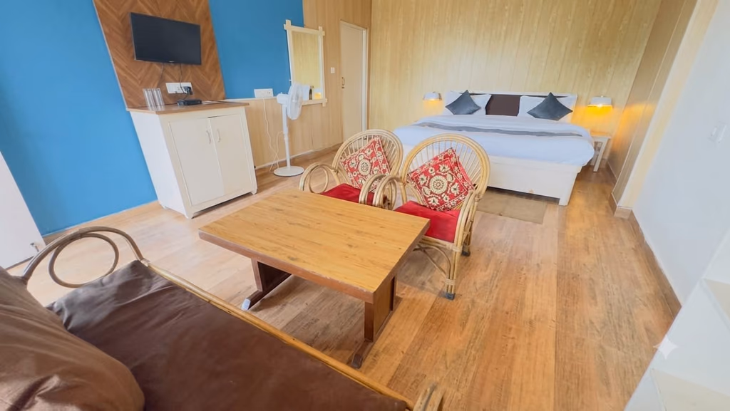 Seating table and cane chairs in Standard room 202