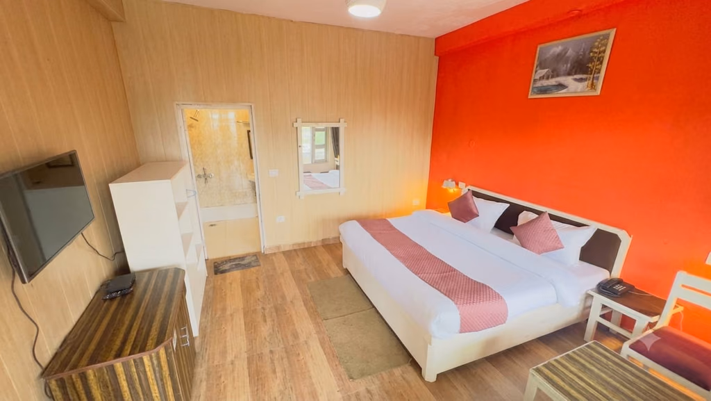 Standard room 201 bed with accent wall