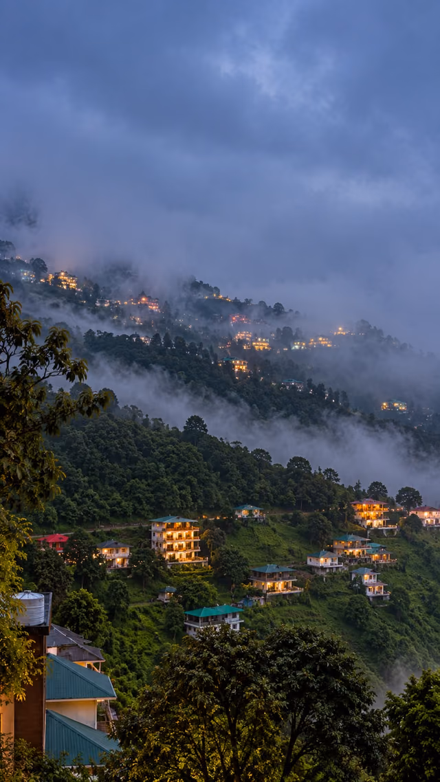 Valley view through mist at dusk